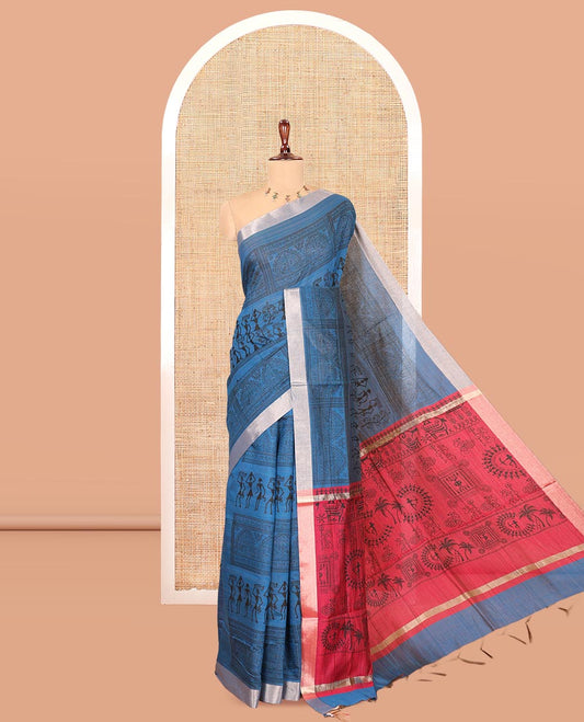 Indigo Blue Semi-Silk Cotton Saree, Adorned with Warli Print, a Tissue Border, Contrast Warli Printed Pallu, and a Contrast Blouse