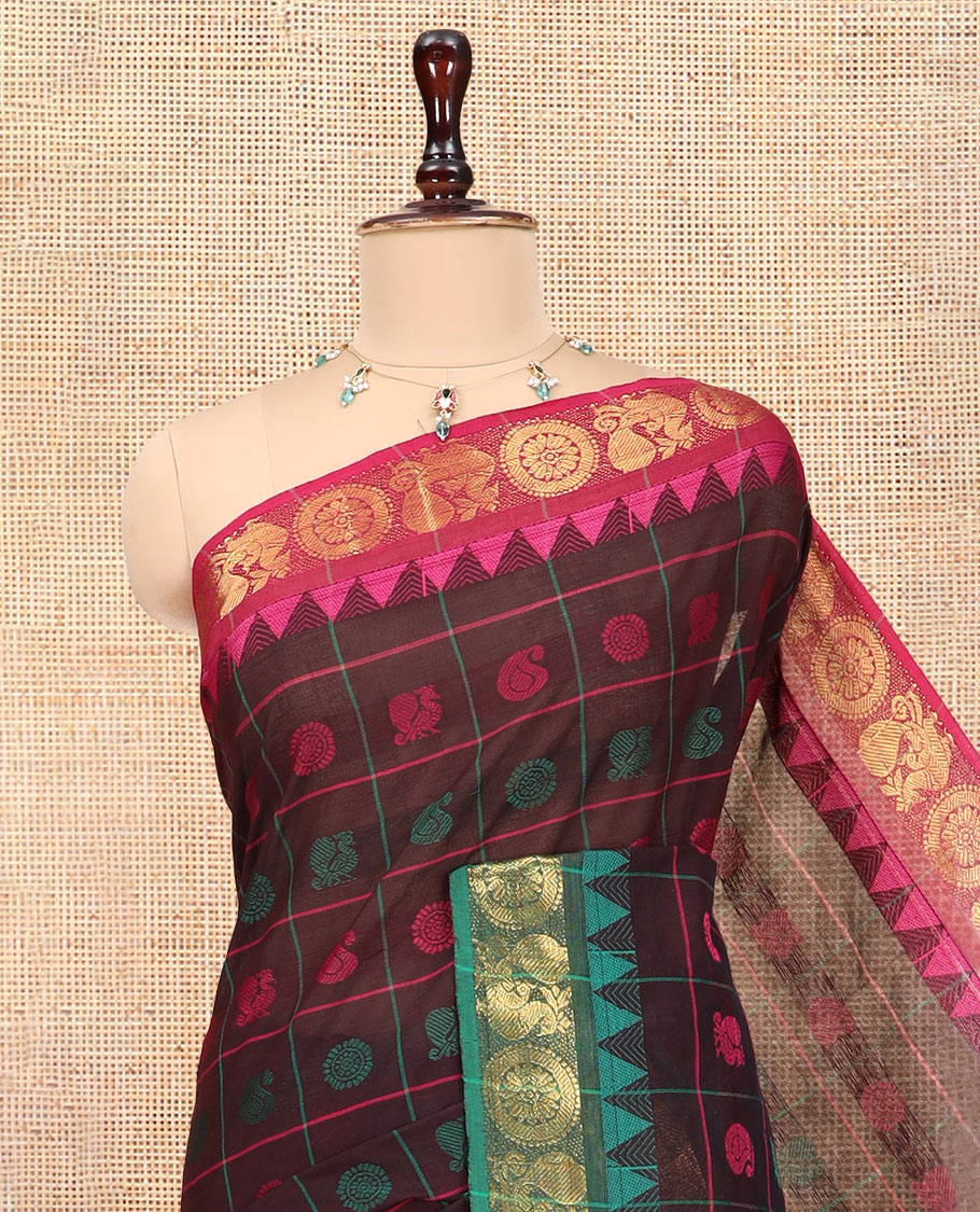Brown Chettinad Cotton Saree Features Butta Enclosed Checks, a Contrast Temple Annam-Peacock Ganga-Jamuna Border, and a Matching Blouse