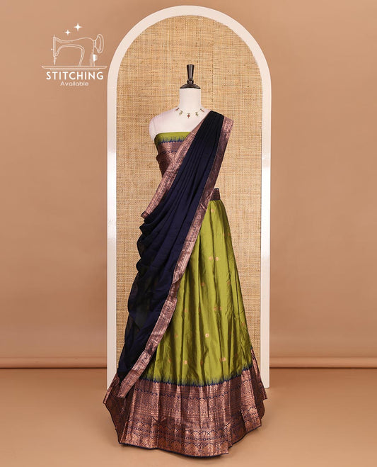 Parrot Green taffeta silk half saree, zari buttas with contrast navy blue traditional zari border, matching zari blouse, and contrast plain zari border dhavani