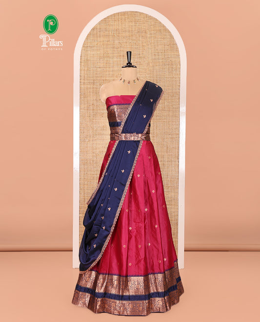 Pink-Blue Semi-Banarasi Half-Saree Subtly Sparkled with Zari Buttas on Its Skirt, Complemented by a Contrast Traditional Zari Temple Rettai Pettu Border, Paired with a Matching Blouse, and a Satin Georgette Embroidered Scallop Dhavani