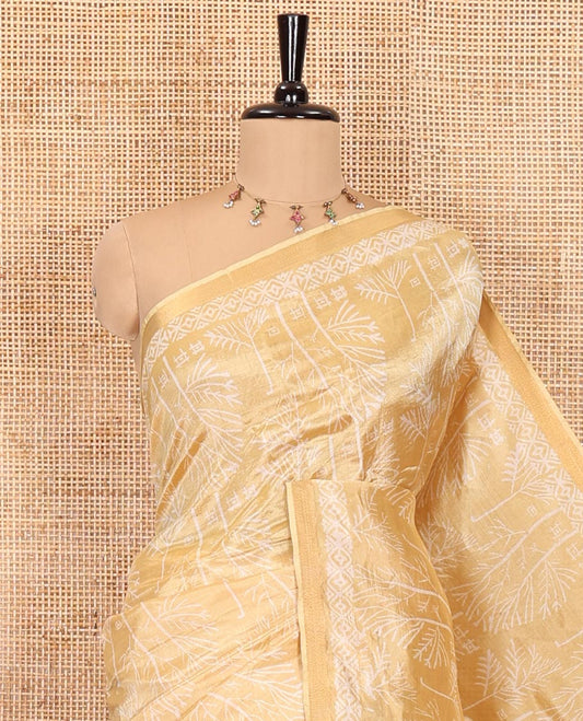 Gold tree motifs printed banana pith saree, zari piping border, floral printed pallu, and a matching printed blouse