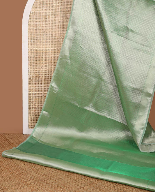 Green brocade design celebrity tissue saree with self border & rich pallu along with plain blouse