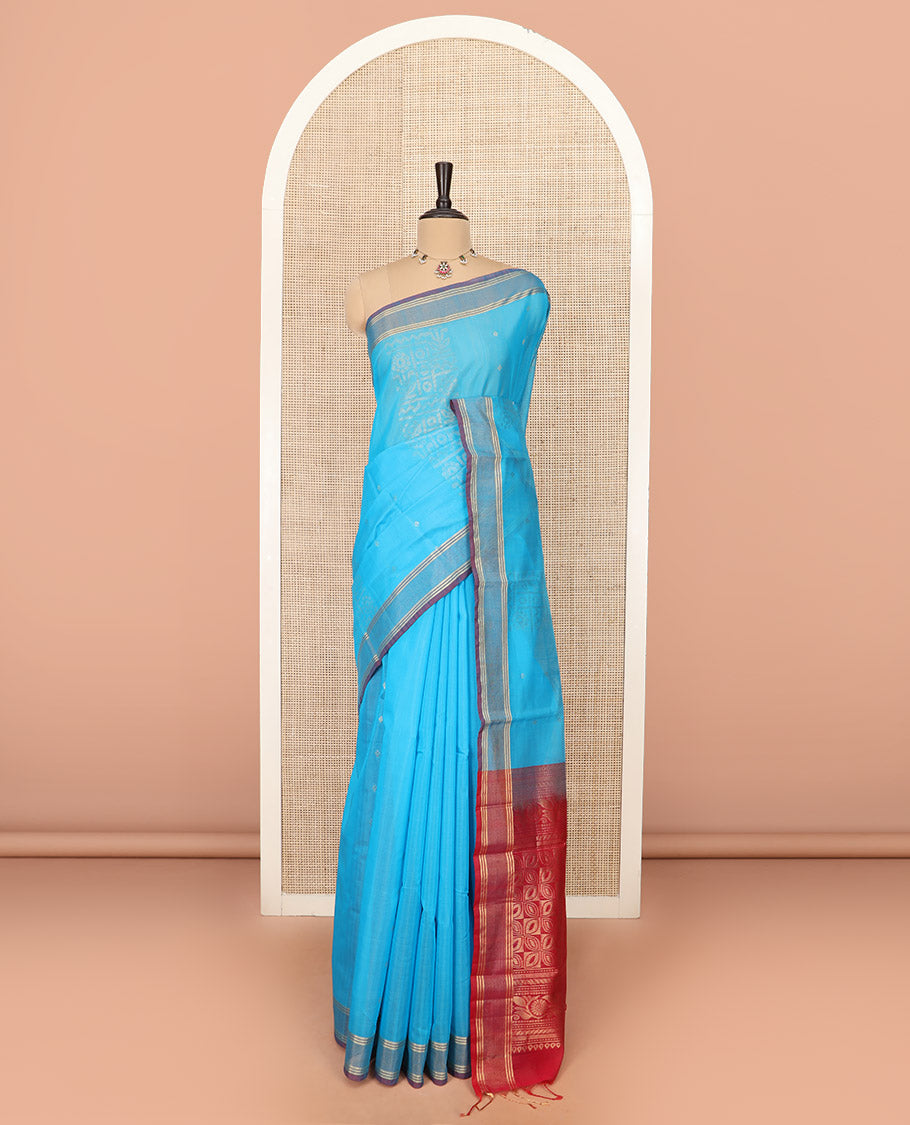 Blue Silk Cotton Saree Sparsely Sparkled with Zari Designs All Over the Body, Complemented by a Contrast Striped Border, Featuring a Contrast Pallu Steeped with Geometric Designs, and Paired with a Contrast Blouse