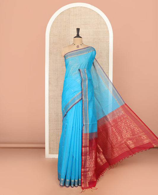 Blue Silk Cotton Saree Sparsely Sparkled with Zari Designs All Over the Body, Complemented by a Contrast Striped Border, Featuring a Contrast Pallu Steeped with Geometric Designs, and Paired with a Contrast Blouse
