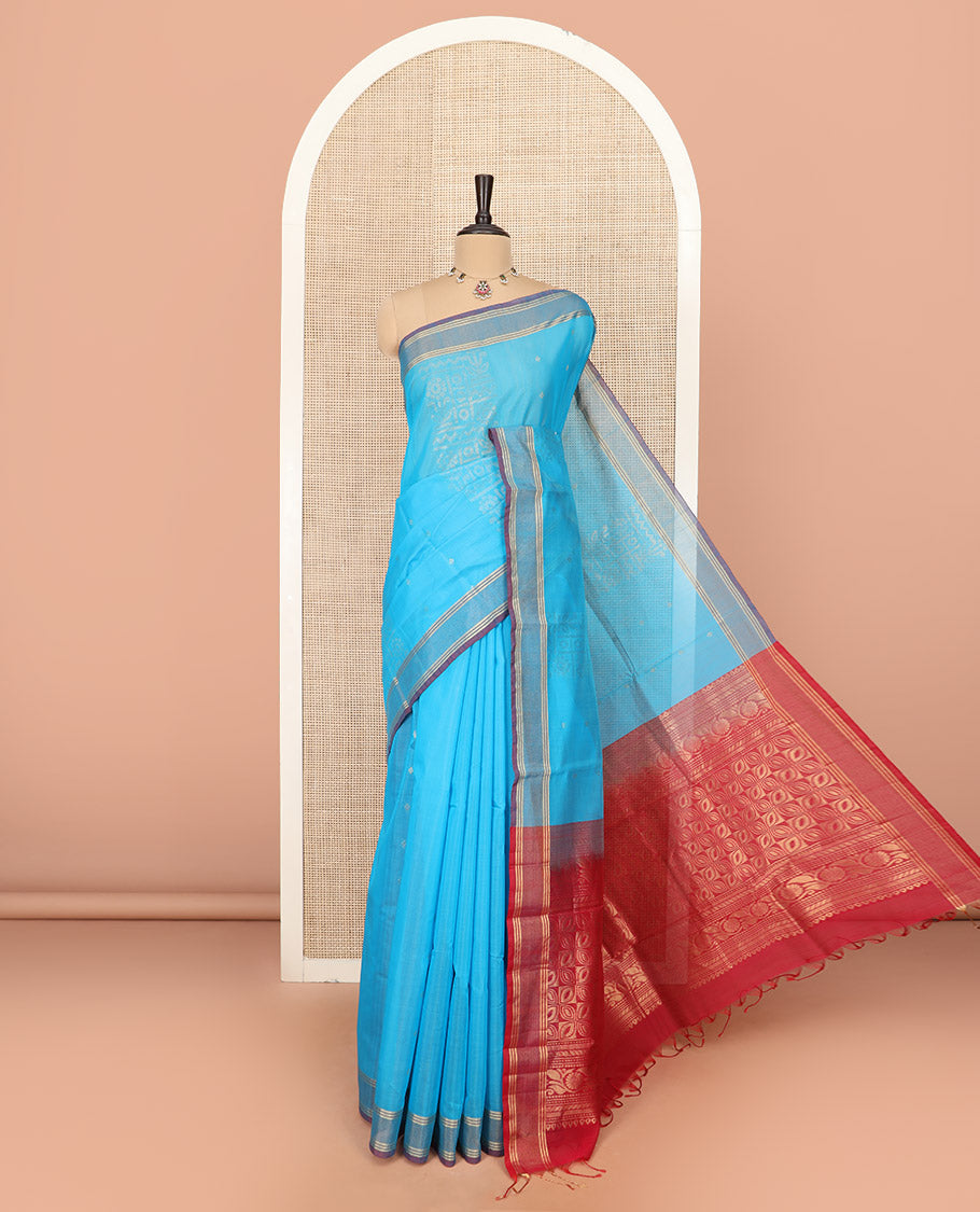 Blue Silk Cotton Saree Sparsely Sparkled with Zari Designs All Over the Body, Complemented by a Contrast Striped Border, Featuring a Contrast Pallu Steeped with Geometric Designs, and Paired with a Contrast Blouse