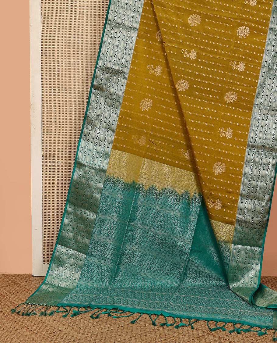 Green floral buttas soft silk saree, contrast traditional zari design border, and pallu of geometric patterns