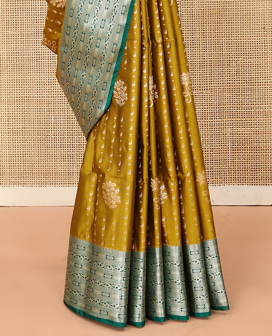 Green floral buttas soft silk saree, contrast traditional zari design border, and pallu of geometric patterns