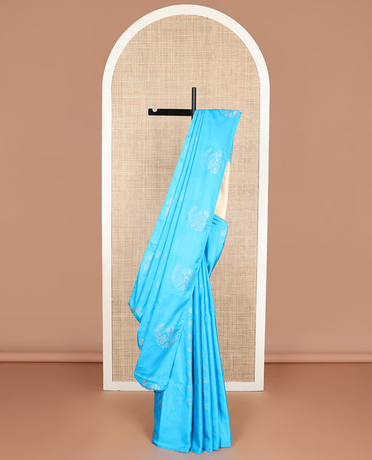 Light blue buttas soft silk saree with self flower design border & zari design pallu