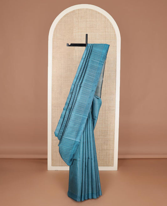 Peacock blue striped tussar silk saree, plain border and zari checked pallu