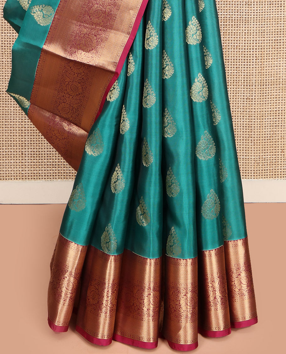 Teal Vasundhara Lite Silk Mix Saree, Elegantly Highlighted with Zari Buttas, Complemented by a Contrast Border of Kodi Visiry Designs, Opulently Embellished Pallu, and Paired with a Contrast Blouse