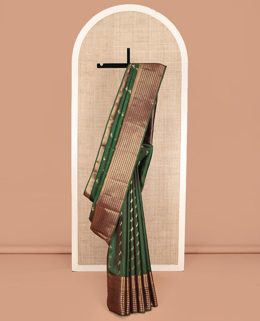 Green Vasundhara Lite Silk Mix Saree, Majestically Detailed with Zari Buttas on Its Body, Complemented by a Contrast Border of Rekku, Kathir, Rudraksham, and Ara Maadam Designs, Grand Geometric Patterned Pallu, and Paired with a Contrast Blouse