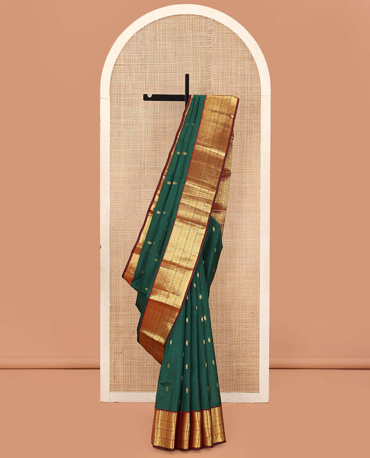 Green Vasundhara Lite Silk Mix Saree, Embellished with Zari Buttas on Its Body, Complemented by a Contrast Border of Traditional Designs, Grand Jaal Pallu, and Paired with a Contrast Blouse