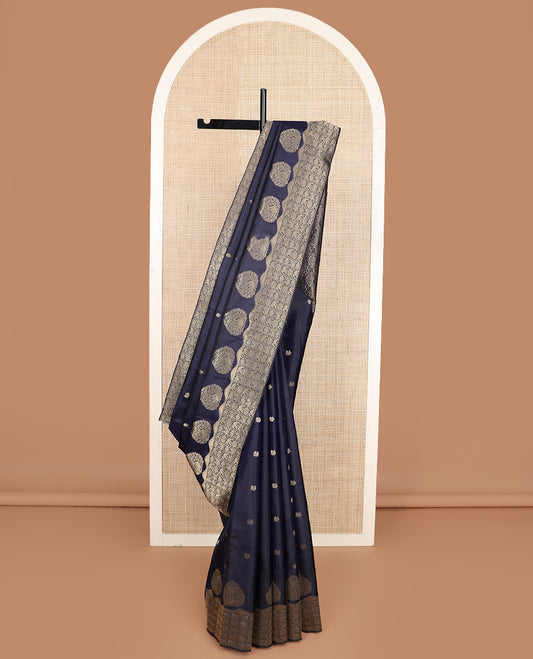 Navy blue zari buttas silk saree, zari border and pallu of zai yaanai, mayil, chakram, and diamond buttas enclosed checks