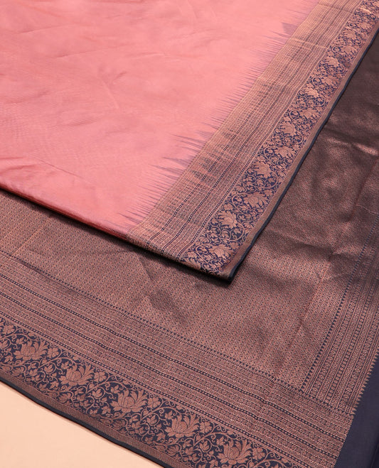 Pink silk saree, contrast border of rekku, muthu, neli, star, and floral designs, and zari-rich jaal pallu