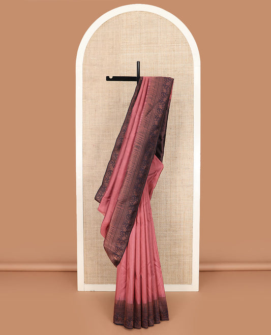 Pink silk saree, contrast border of rekku, muthu, neli, star, and floral designs, and zari-rich jaal pallu