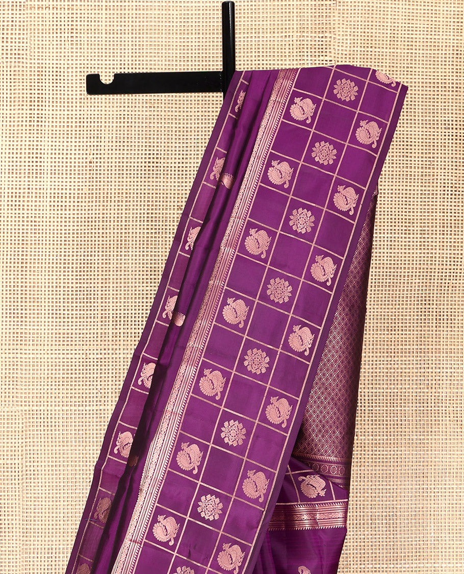 Purple Vasundhara Silk Saree, Artfully Detailed with Zari Buttas, Highlighted by a Zari Border of Rekku, Muthu, Jada Nagam, and Butta Enclosed Checks, Jaal Pallu, and a Matching Blouse