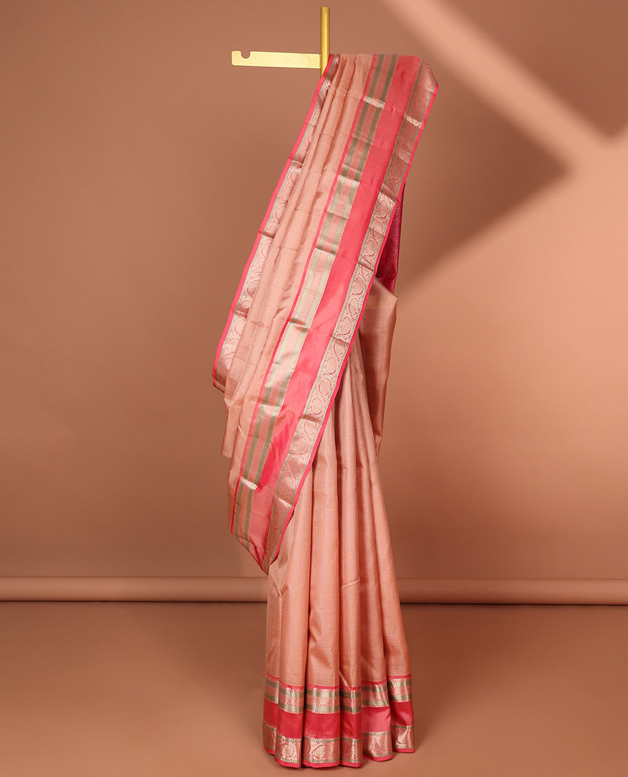 Pink checked silk saree with contrast border of thilakam mokku, banaras, kuyil kann, poo chakram design & jaal design pallu