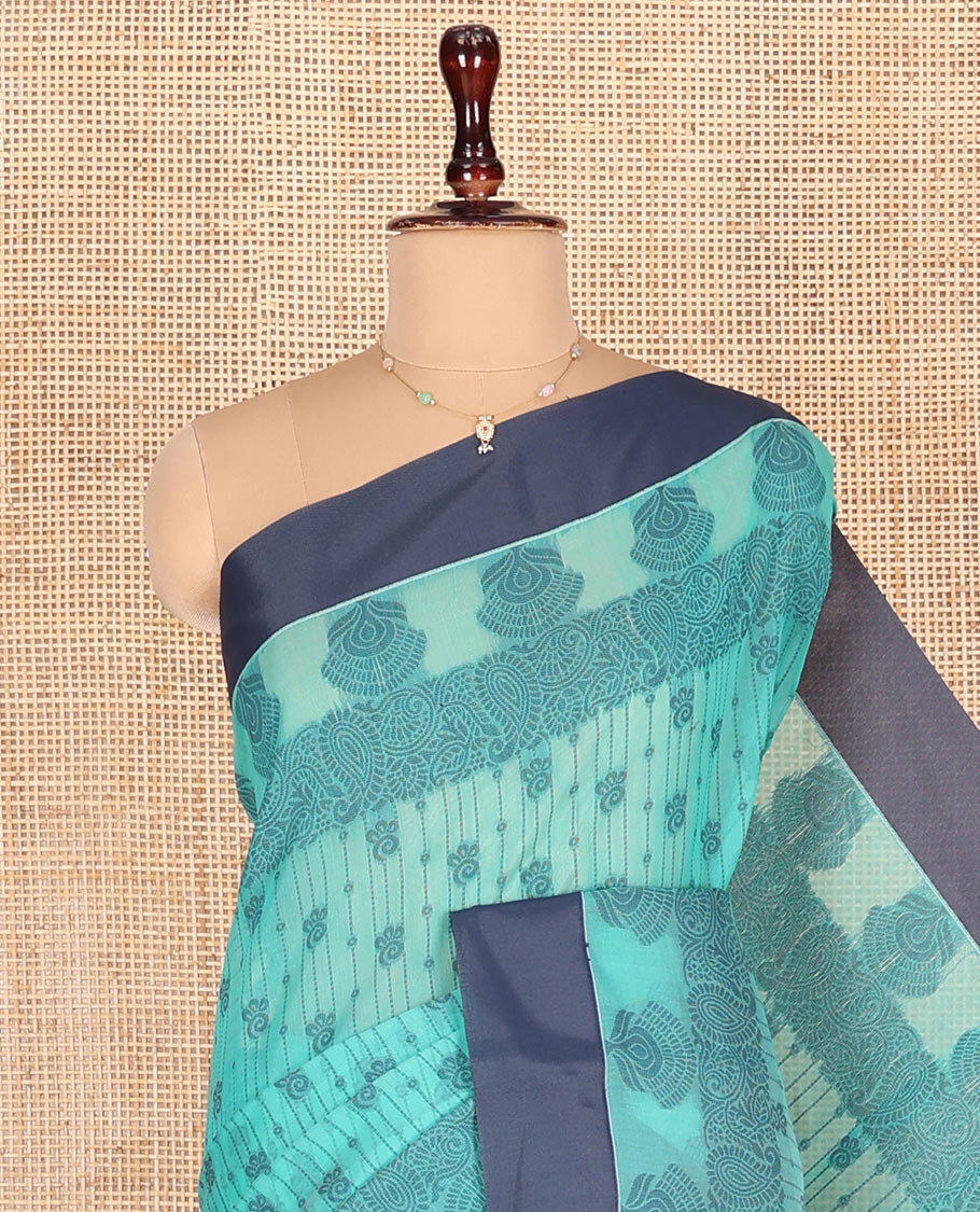 Green Semi-Silk Cotton Saree, Subtly Sparkled with Stripes and Buttas All Over Its Body, Complemented by Contrast Border, Intricately Designed Pallu, and Paired with a Matching Blouse