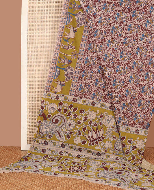 Terracotta red floral machine-printed kalamkari cotton saree, contrast pichwai cow printed border & pallu of peacock-floral print