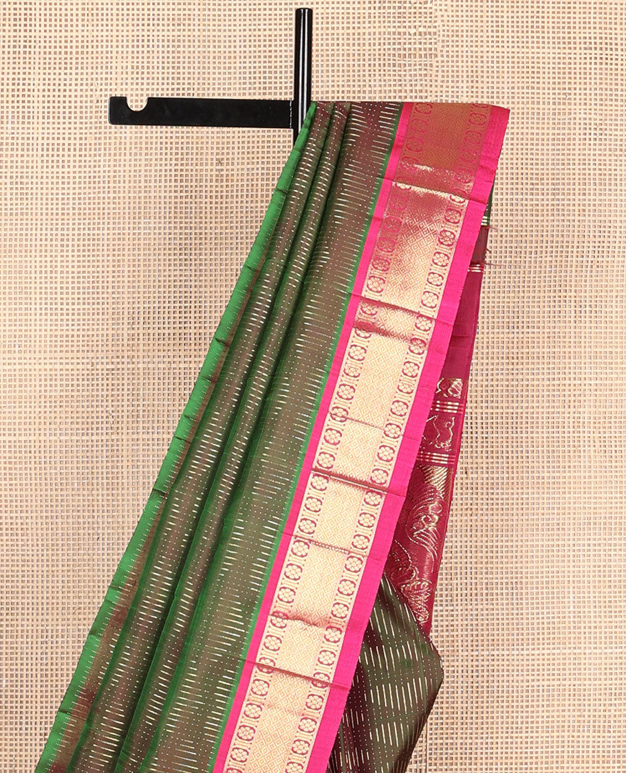 Green dual-tone zari buttas Kanchipuram silksaree, contrast one-sided border of kamalam & mayil kann design & intricate pallu