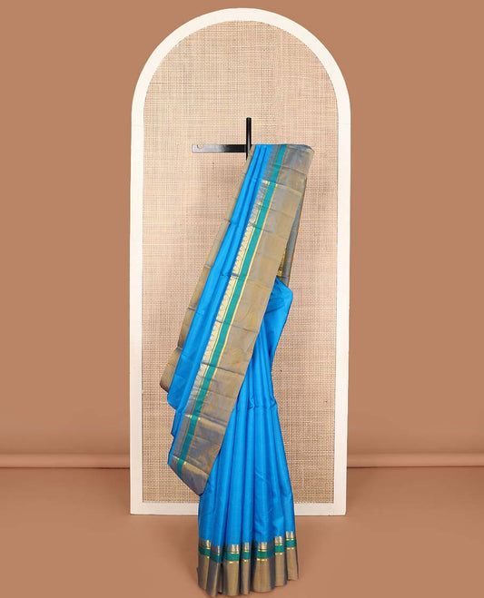 Blue striped Kanchipuram silk saree, contrast border of thazampoo rekku, and kathir designs, and striped pallu
