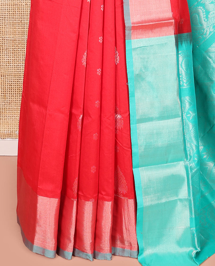 Red Kuppadam Cotton Saree, Gleamed Up with Zari Buttas All Over Its Body, Complemented by a Bavanji Border, Pallu of Intricate Designs, and Paired with a Contrast Blouse