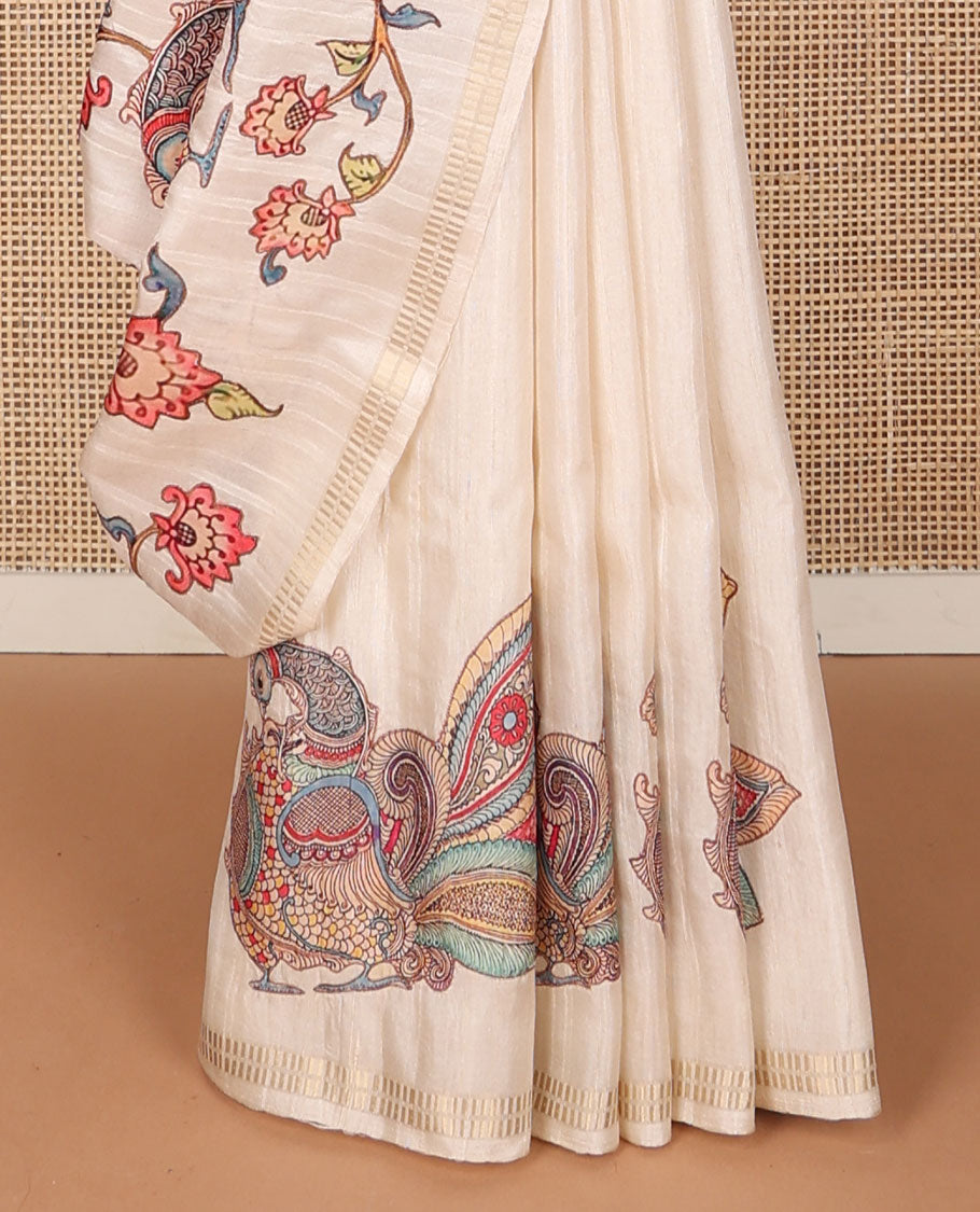 Cream colorful kalamkari-style floral & peacock motifs printed tussar saree, zari border & pallu of zari stripes