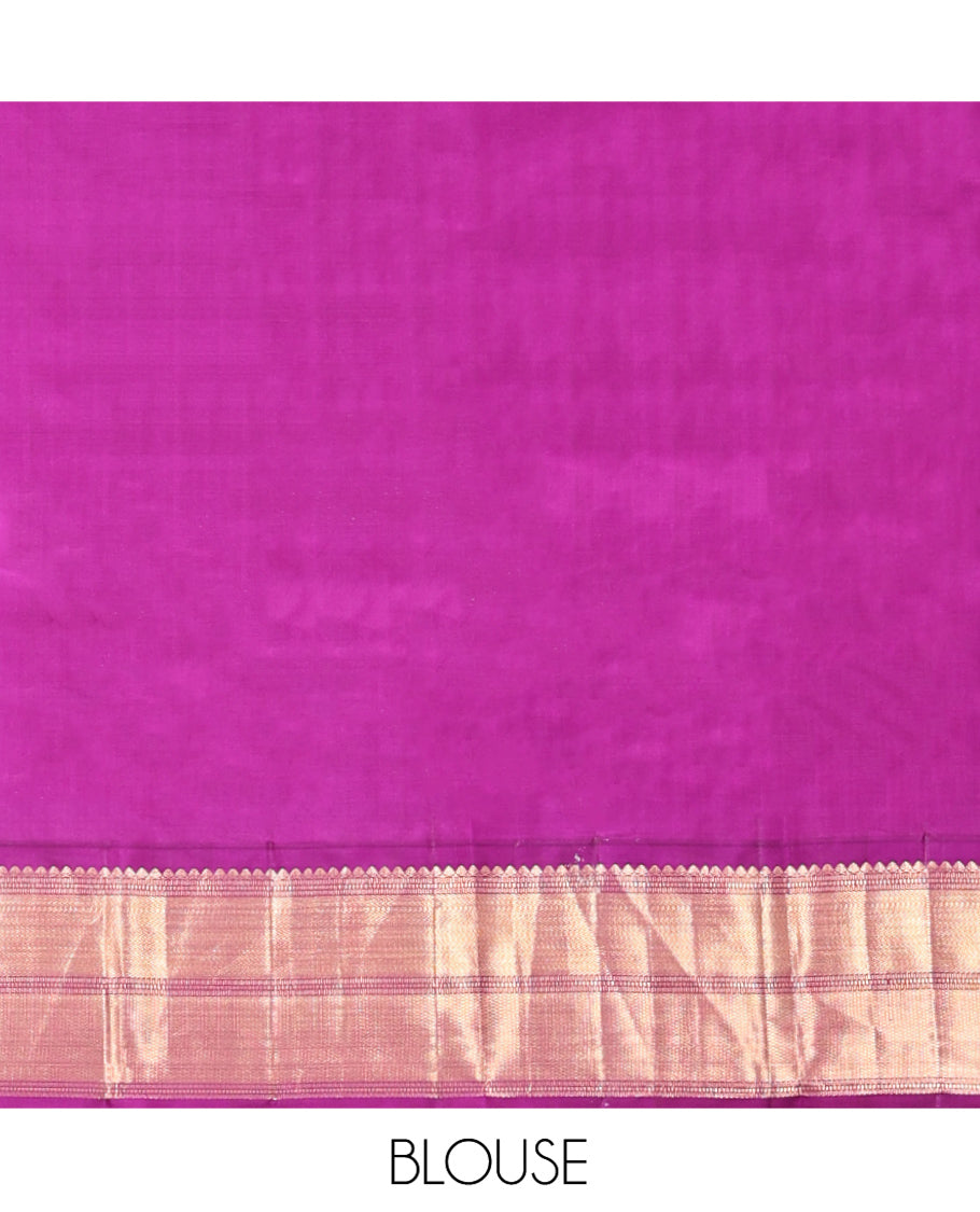Grey Vasundhara Silk Saree, Adorned with Zari Buttas All Over Its Body, Complemented by a Contrast Border of Thilakam Mokku, Muthu, Vanki, and Mayil Kann Designs, Grand Manga Design Pallu, and Paired with a Contrast Blouse