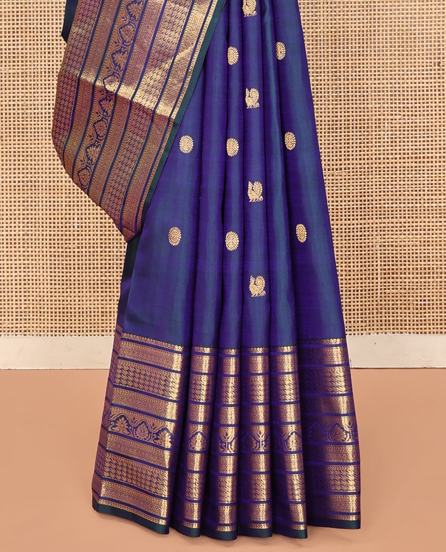 Blue Kanchipuram Silk Saree, Embellished with Mayil and Chakram Buttas All Over Its Body, Highlighted by a Zari Border of Traditional Designs, Pallu Steeped with Traditional Designs, and Paried with a Matching Blouse