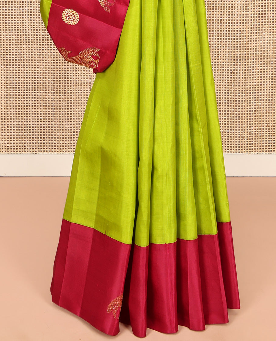 Green Kanchipuram Silk Saree, Styled with Chakram Buttas, Complemented by a Contrast One-Sided Korvai Border of Mayil and Chakram Designs, Pallu Steeped with Mayil Designs, and No Blouse