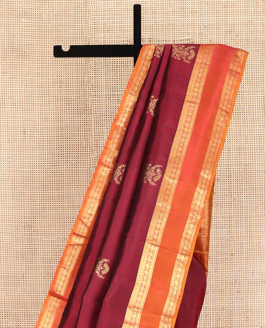 Red Kanchipuram Silk Saree, Enriched with Zari Buttas All Over Its Body, Complemented by Contrast Rettai Pettu Border of Manga Mokku, Muthu, Banaras, and Poun Designs, Grand Pallu, and Paired with a Contrast Blouse