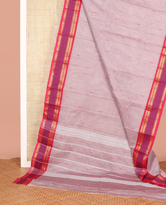 Pale Pink Chettinad Cotton Saree, Elegantly Woven with Buttas on Its Body, Complemented by a Contrast Traditional Zari Design Border, and Pallu of Stripes