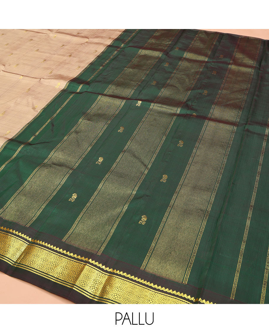 Sandal Kanchipuram Silk Saree, Elevated with Zari Buttas on Its Body, Complemented by a Contrast One-Sided Temple Border of Thilakam Mokku, and Jaal Designs, Pallu Depicts Zari Designs, and Comes Without a Blouse