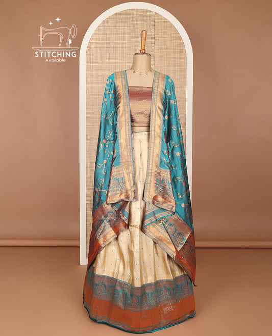 Cream buttas banaras half saree with contrast traditional zari design border, zari design blouse & light blue floral vine design dhavani