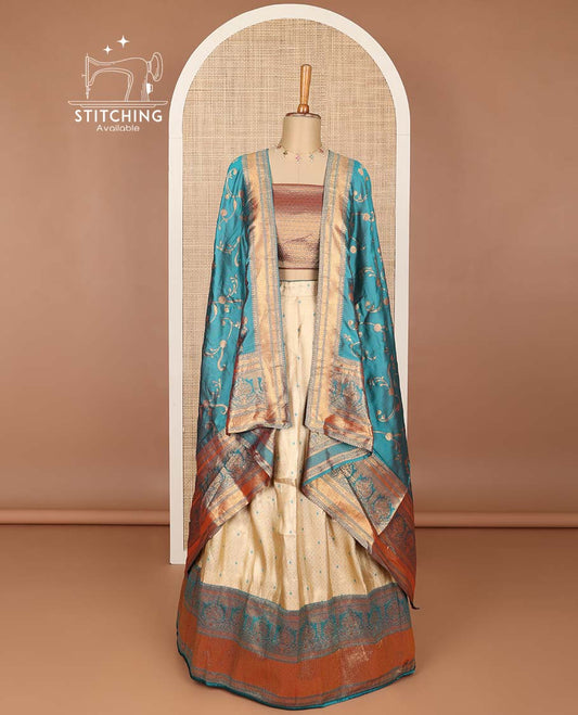 Cream buttas banaras half saree with contrast traditional zari design border, zari design blouse & light blue floral vine design dhavani