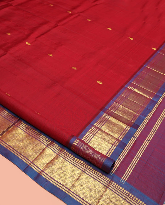 Red Kanchipuram Silk Saree, Decked Up with Zari Buttas, a Contrast One-Sided Border of Panner Sombu, Banaras, and Mayil Kann, Zari Design Pallu, and No Blouse