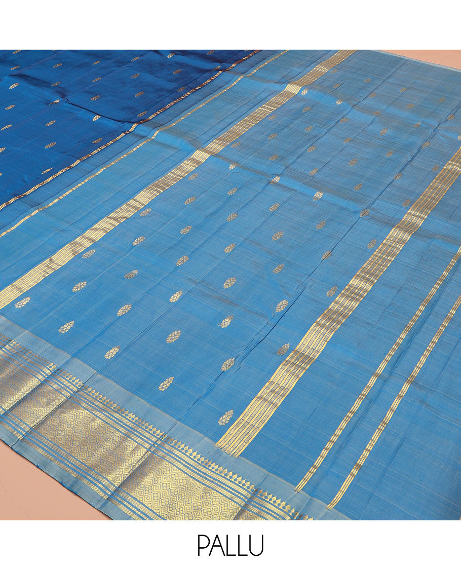 Blue Kanchipuram Silk Saree, Beautified with Zari Buttas on Its Body, Complemented by a Contrast One-Sided Border of Panner Sombu, Banaras, Muthu, and Jaal Designs, Pallu Depicts Zari Designs, and Comes Without a Blouse