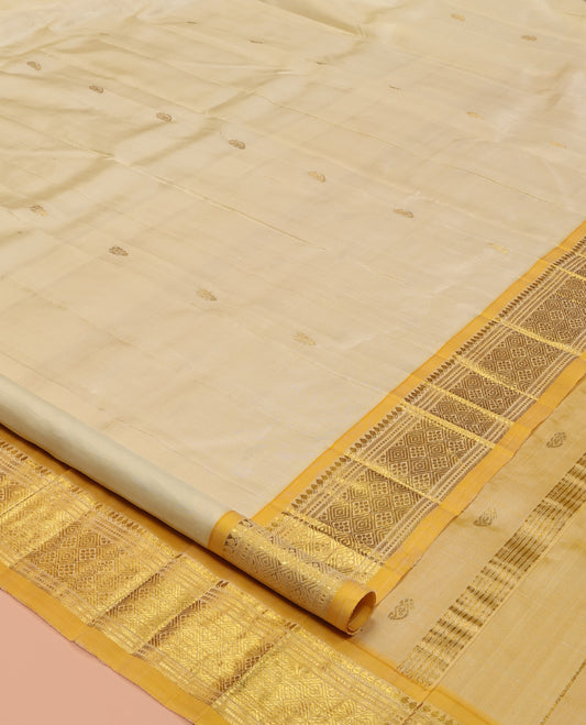Sandal Kanchipuram Silk Saree, Subtly Sparkled with Zari Buttas, a Contrast One-Sided Border of Thilakam Mokku, Banaras, Muthu, and Jaal Designs, Zari Design Pallu, and No Blouse