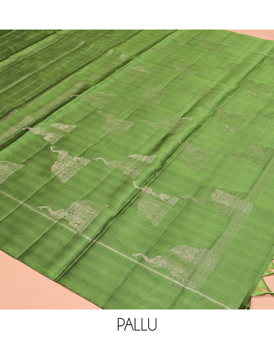 Green Mayuri Soft Silk Saree, Subtly Decked Up Zari Stripes All Over Its Body, Highlighted by Self-Border, Pallu Steeped with Elephant Motifs, and Paired with a Matching Blouse