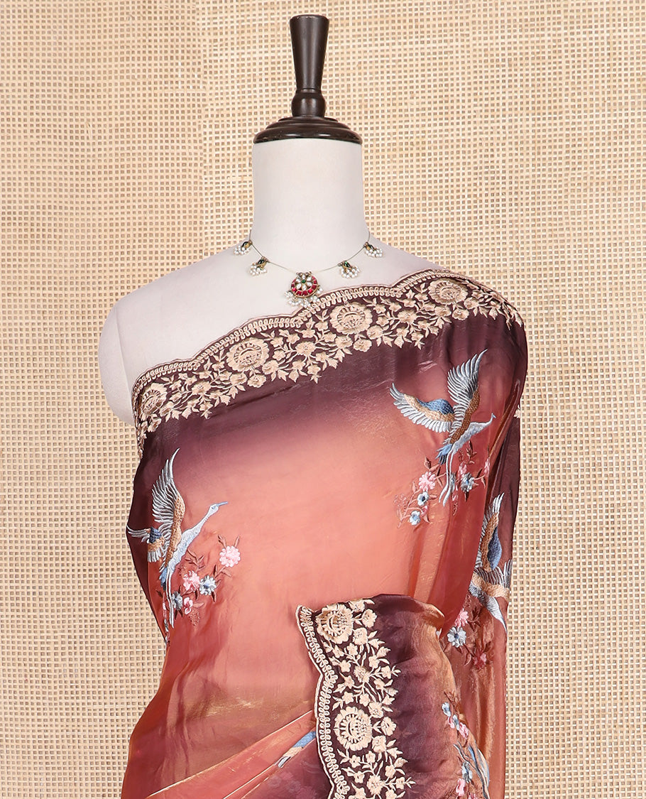 Orange crane and floral motifs thread embroidered designer saree, scallop floral thread embroidered border, and embroidered pallu