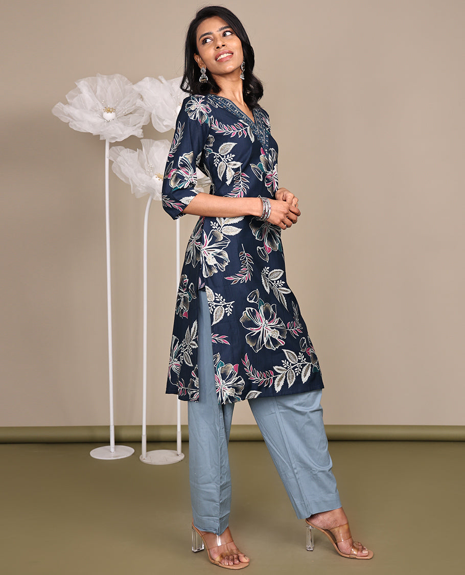 Blue Floral Printed Knee-Length Cotton Kurti, Prettified with a V-Neckline, 3/4 Sleeves, and a Straight-Cut Length