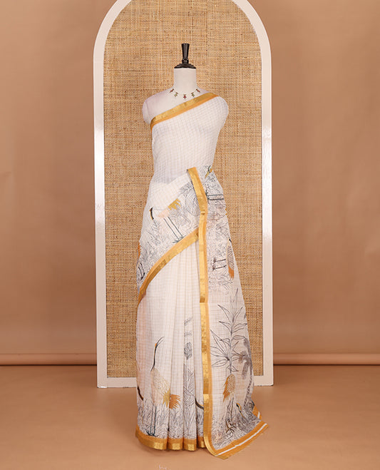 White with mustard zari checks linen saree with contrast border and unique designs of pallu along with contrast plain blouse