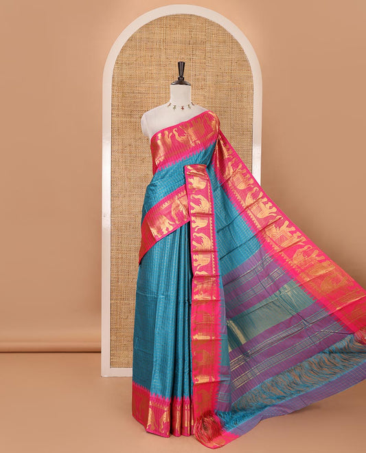 Blue checked semi-tafeta saree, contrast temple zari elephant motifs border, striped pallu & matching checked zari border blouse