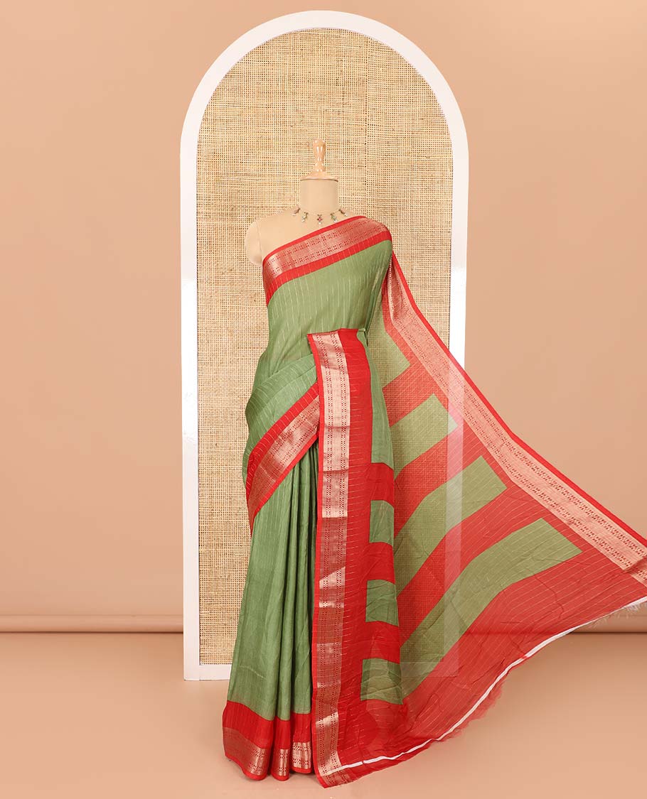 Green vertically striped moss chiffon saree with contrast traditional zari design borders, striped pallu, and a contrast blouse