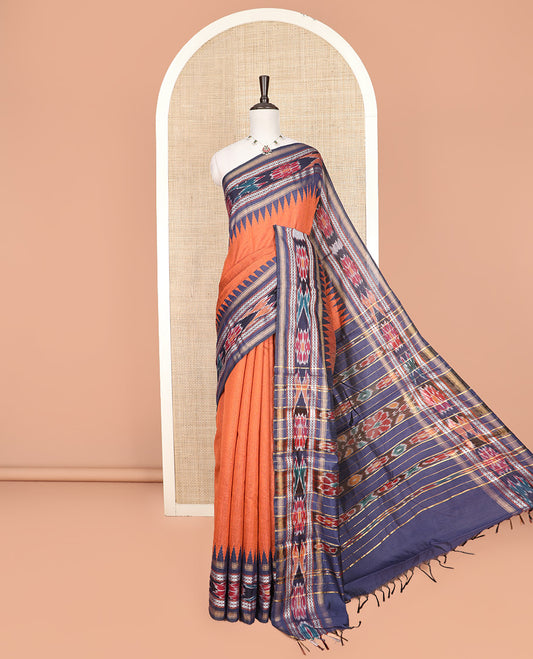 Orange Plain Dupion Silk Saree, Highlighted by a Contrast Temple Border of Geometric Patterns and Ikkat Weave, Pallu Depicting Floral Ikkat Designs, and Paired with a Contrast Blouse