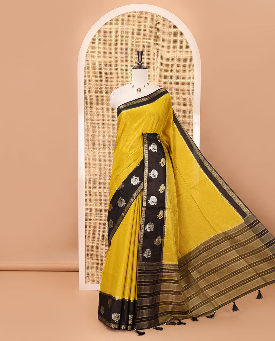 Mustard plain Banarasi tissue silk saree, contrast traditional zari peacock border, zari striped pallu & floral jaal jacquard black blouse