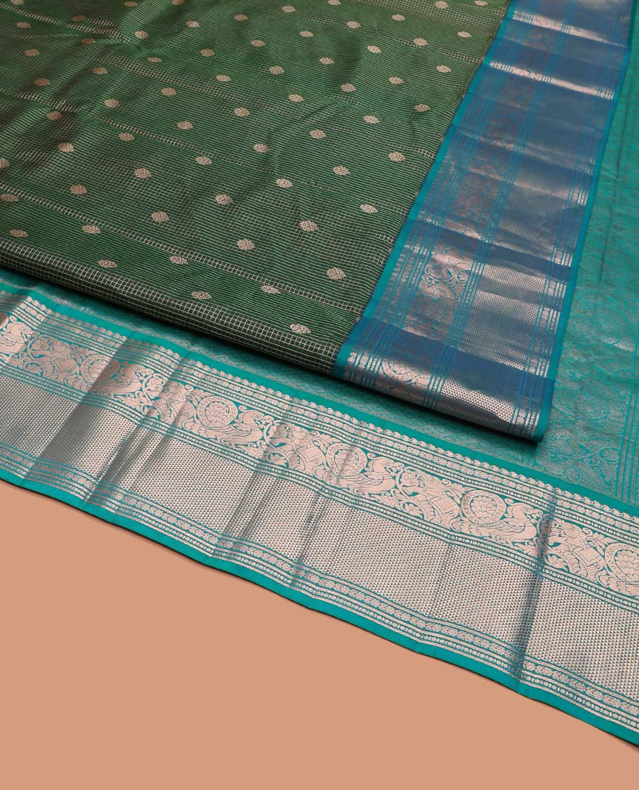 Green Vasundhara Silk Saree, Steeped in Richness of Zari Buttas and Checked Design on Its Body, Complemented by a Contrast Border of Manga, Floral, Mayil, Yaanai, and Ara Maadam Designs, Opulently Embellished Jaal Pallu, and Paired with a Contrast Blouse