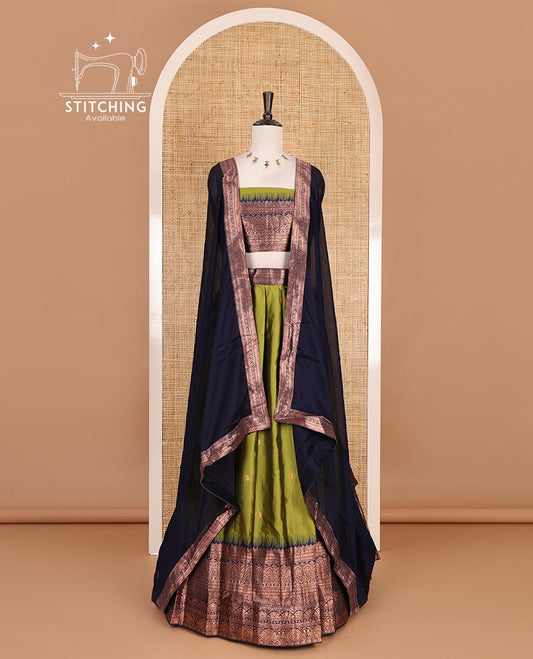 Parrot Green taffeta silk half saree, zari buttas with contrast navy blue traditional zari border, matching zari blouse, and contrast plain zari border dhavani