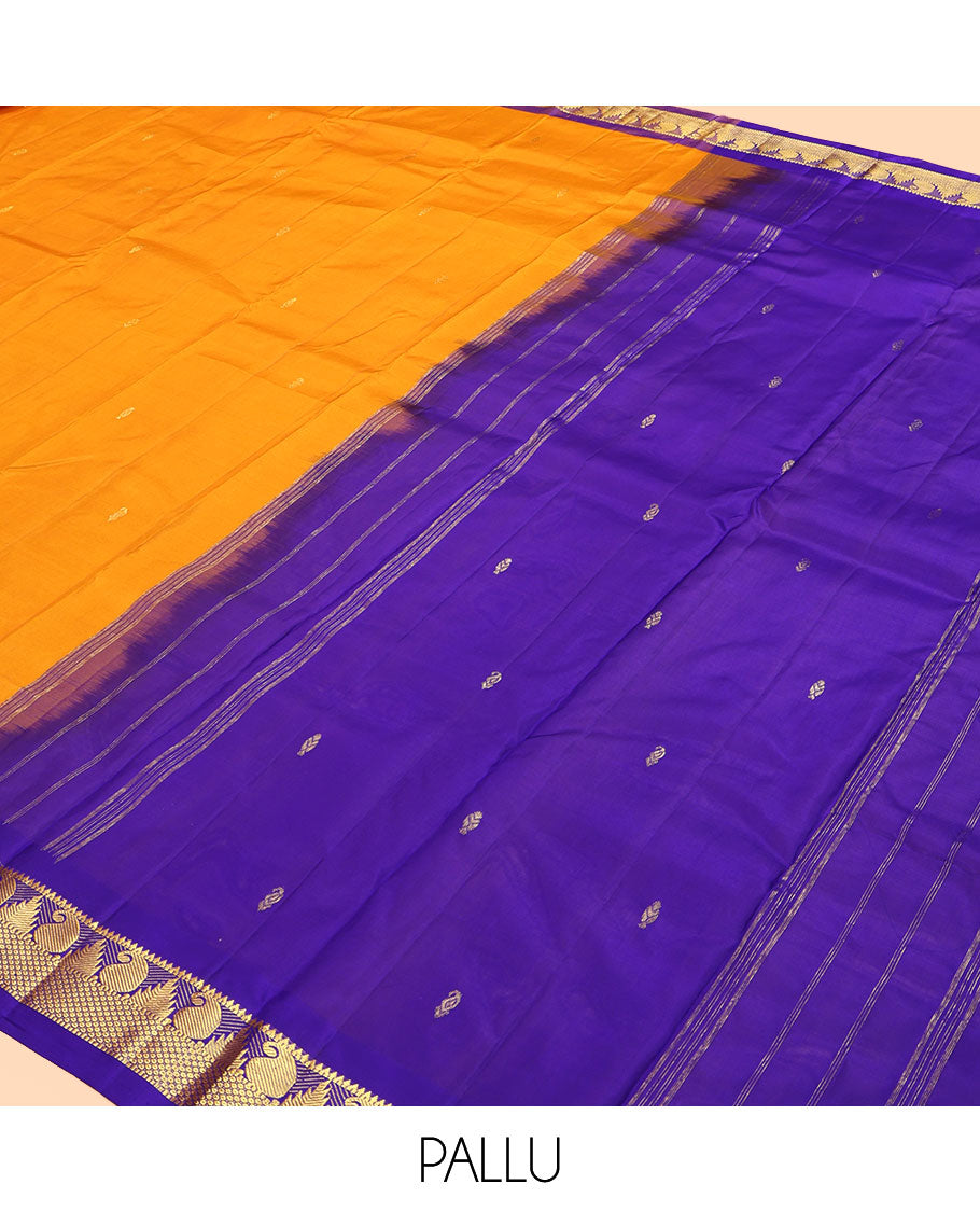 Yellow Kanchipuram Silk Saree, Subtly Sparkled with Zari Buttas, a Contrast Border of Thazampoo Rekku, Muthu, Manga, and Mayil Kann Designs, Zari Pallu, and a Contrast Blouse