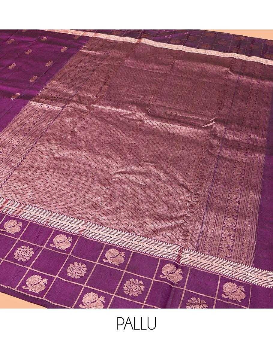 Purple Vasundhara Silk Saree, Artfully Detailed with Zari Buttas, Highlighted by a Zari Border of Rekku, Muthu, Jada Nagam, and Butta Enclosed Checks, Jaal Pallu, and a Matching Blouse
